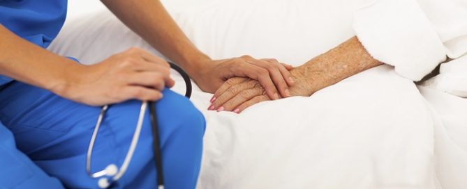 nurse caring for bedridden patient