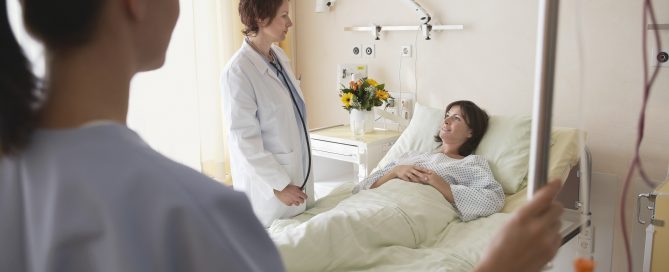 patient using hospital bed mattress